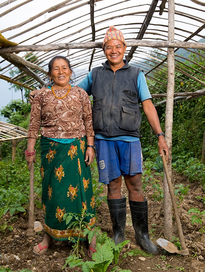 Agriculture training participants in their greenhouse